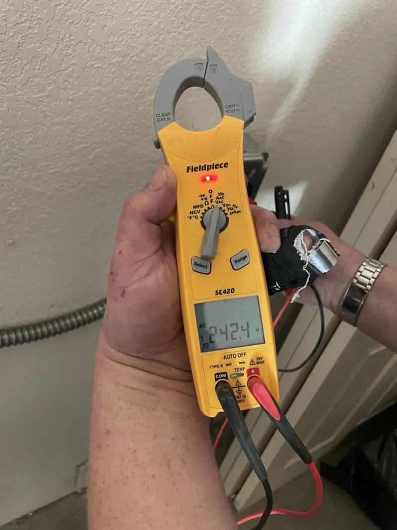 Voltage testing with clamp meter during Electrical Installation Services in Port Washington North